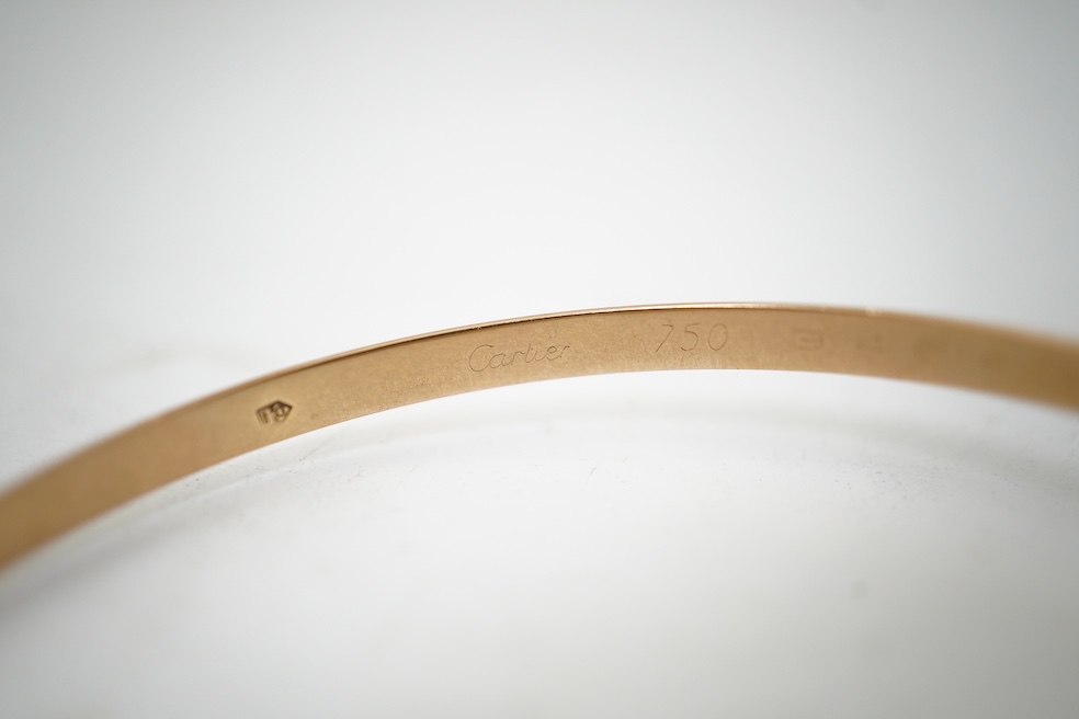 Cartier, a gold bangle, 'Trinity de Cartier'